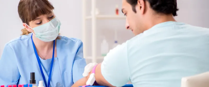 Bloodwork being drawn in a clinical setting